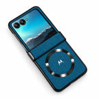 A blue fabric-textured flip phone case with a black magnetic ring and camera cutout, shown open with a phone inside on a white background.