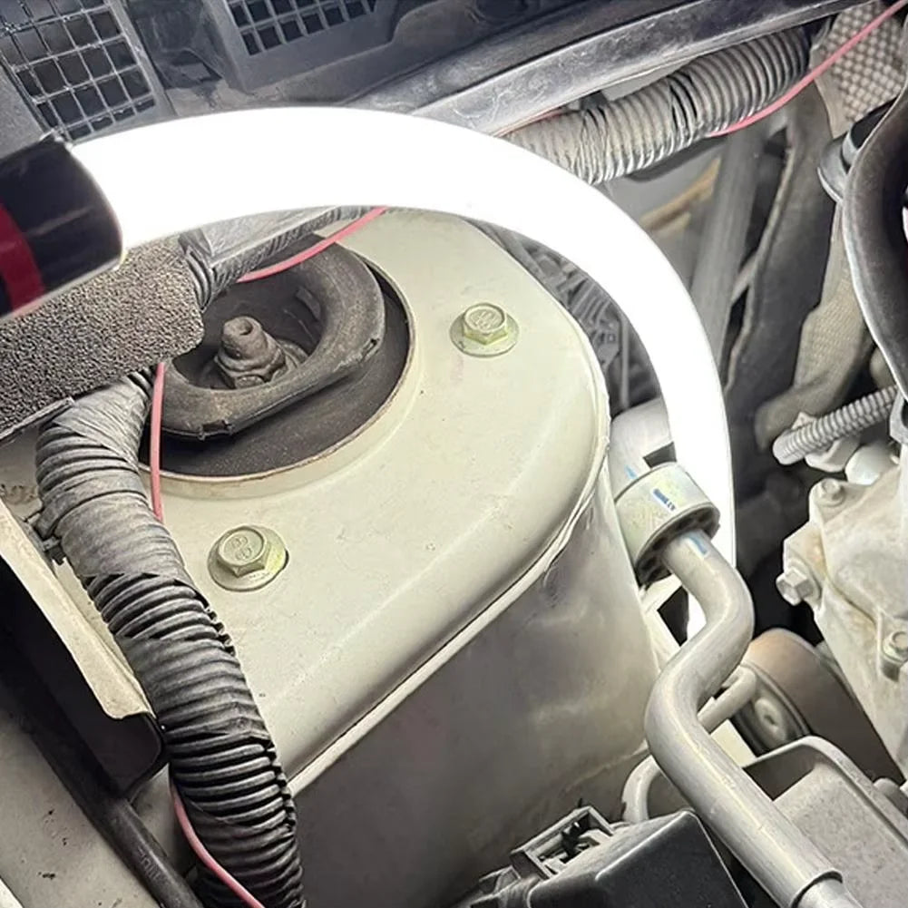 Close-up of a car engine with a focus on mechanical components.