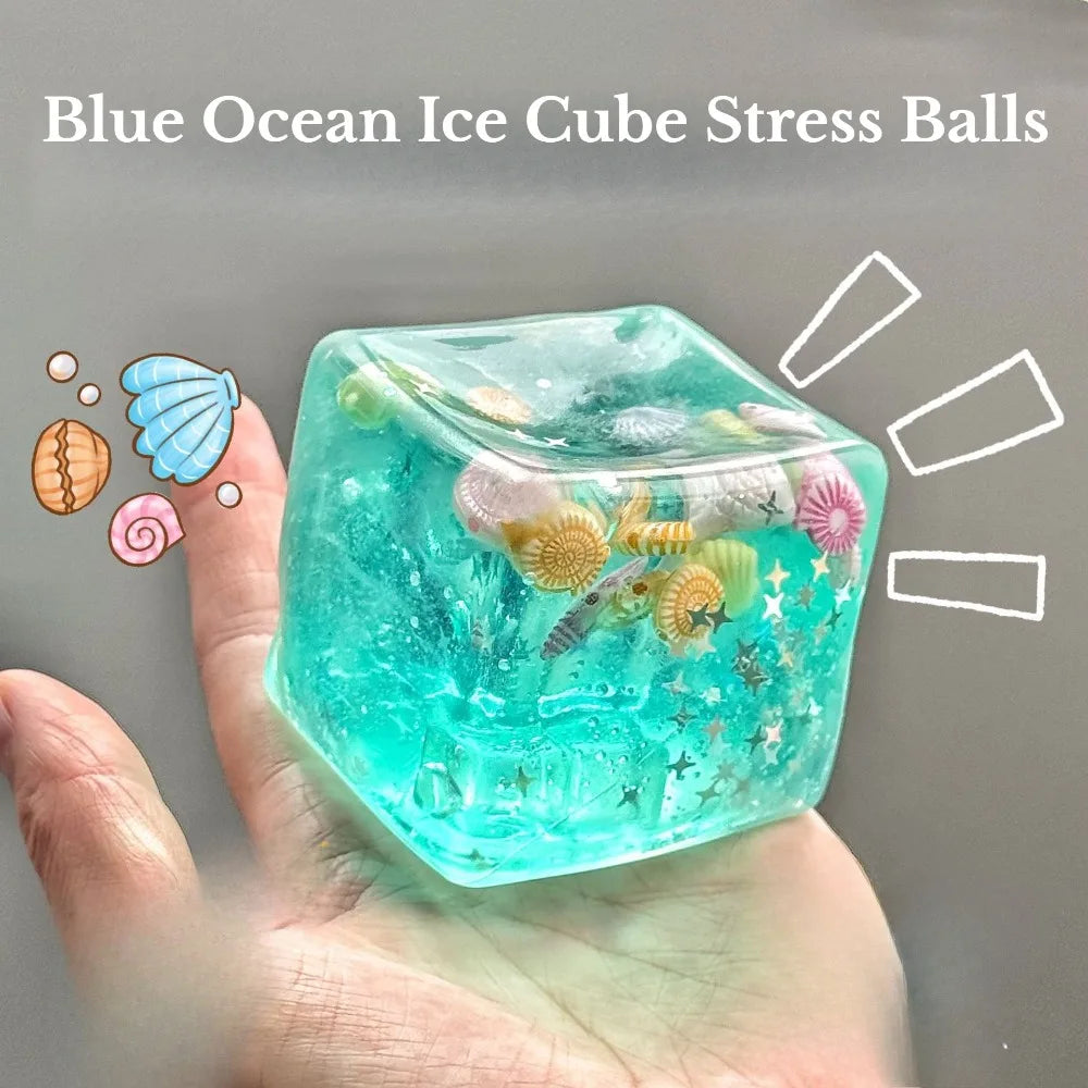 hand holding blue squishy stress balls cube filled with ocean figures for calming sensory squeeze play
