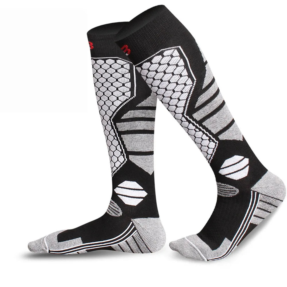 Winter warm knee high ski socks in classic black and white pattern with compression fit