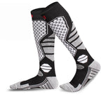 Winter warm knee high ski socks in classic black and white pattern with compression fit