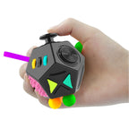 hand holding twelve sided fidget cube with colourful buttons and joystick for tactile focus