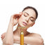 24K gold T-shape face roller massager by PennyHaul with a sleek gold finish, designed for facial firming and massage therapy.