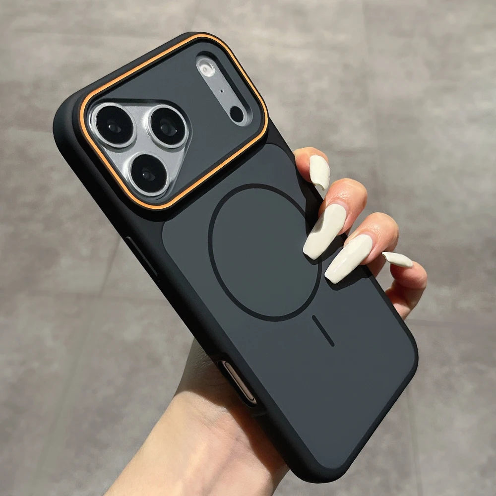 A hand with long white manicured nails holds a black magnetic phone case with a gold accent border around the camera cutout, shown against a gray tiled background. Main image