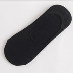 Single piece of solid black mens invisible slipper sock designed for running and casual shoes