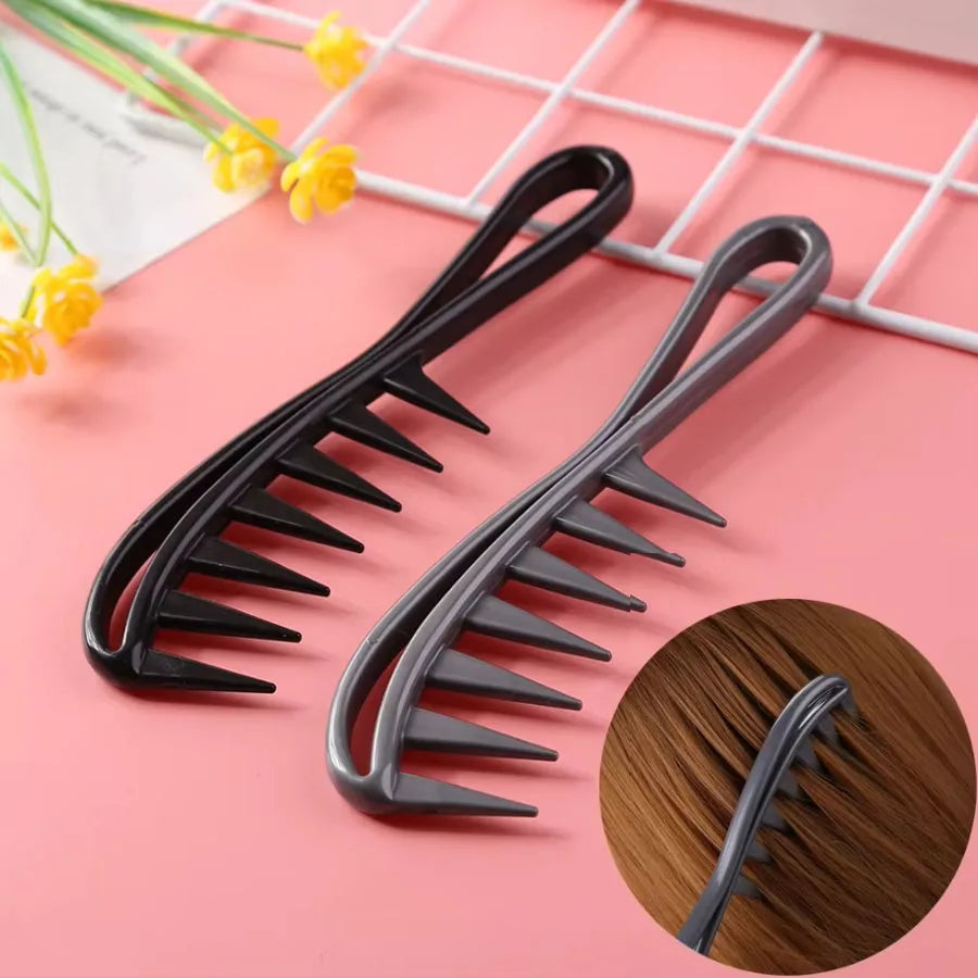 Two hair styling combs, one black and one gray, on a pink surface with a close-up of brown hair. Main image