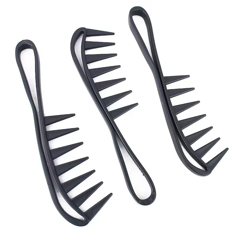 Three black hair detangling combs on a white background