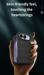 A hand holding a smartphone with a dark gray protective case, set against a dark background with the text 'Skin-friendly feel, touching the heartstrings'.