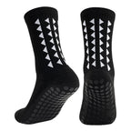 Black anti slip athletic grip socks showcasing the elastic cuff and standard thickness for exercise