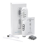 Electric scalp massage comb with packaging, user manual, USB cable, and plug on a white background