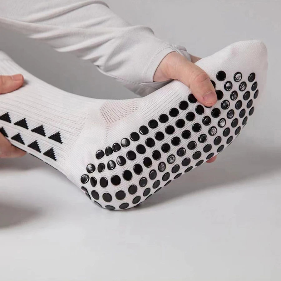 Close up view of the bottom of a football grip sock showing the anti slip rubber pads for maximum traction