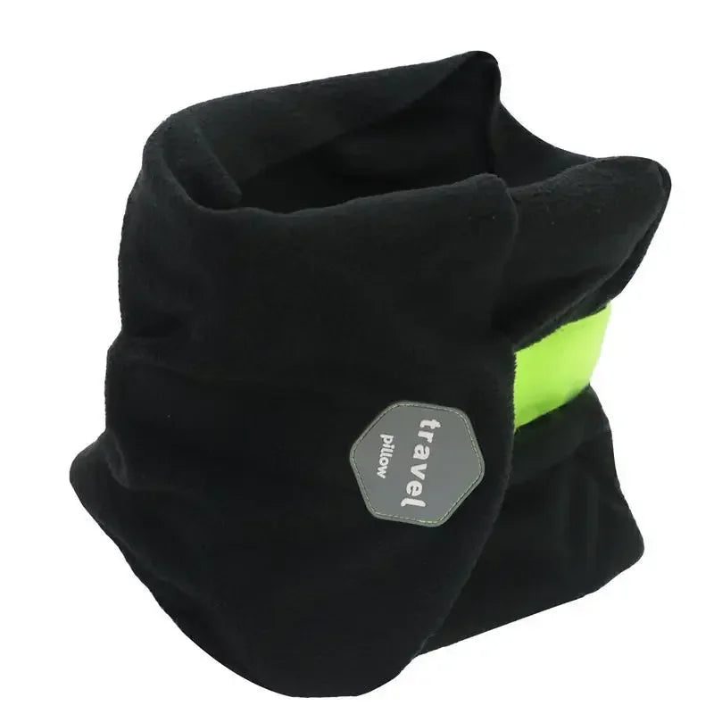 Black travel pillow with a green accent on a white background