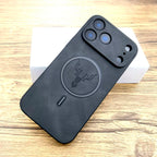 Black phone case with deer emblem on a wooden surface