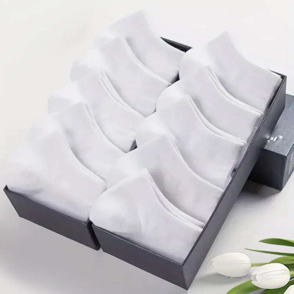 Pack of men's low cut cotton socks in solid white color neatly organized in a display box