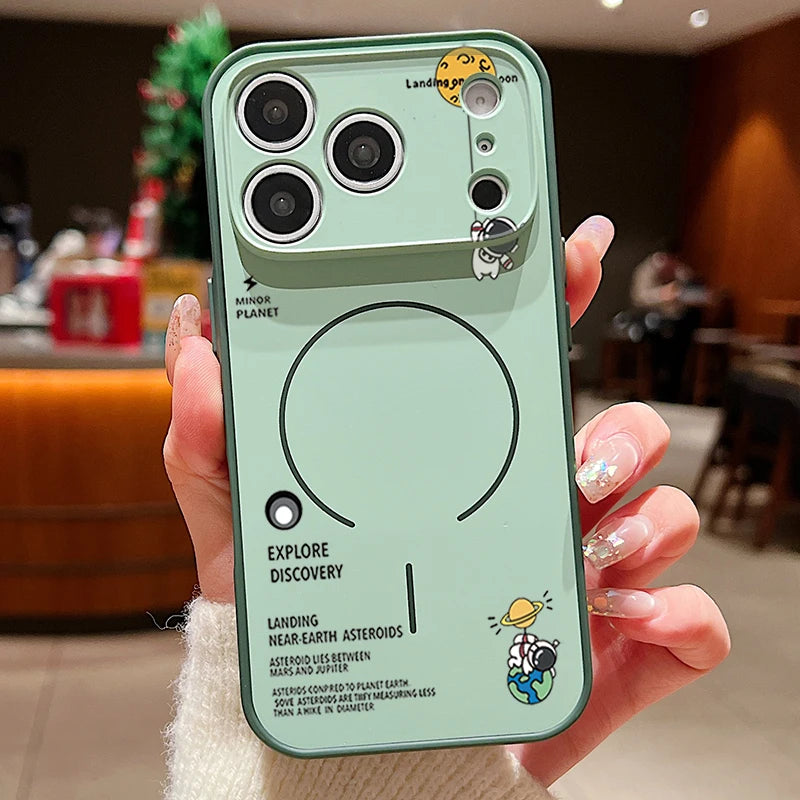 Green phone case with space-themed design held by a person in an indoor setting