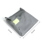 Gray pet bed with a yellow label and measurements on a white background