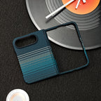 A dark blue and teal striped phone case with a textured pattern, displayed on a dark textured surface next to a vinyl record prop.