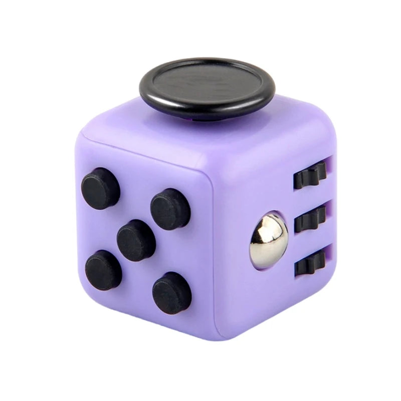 Purple fidget cube with black buttons and a gold accent on a white background