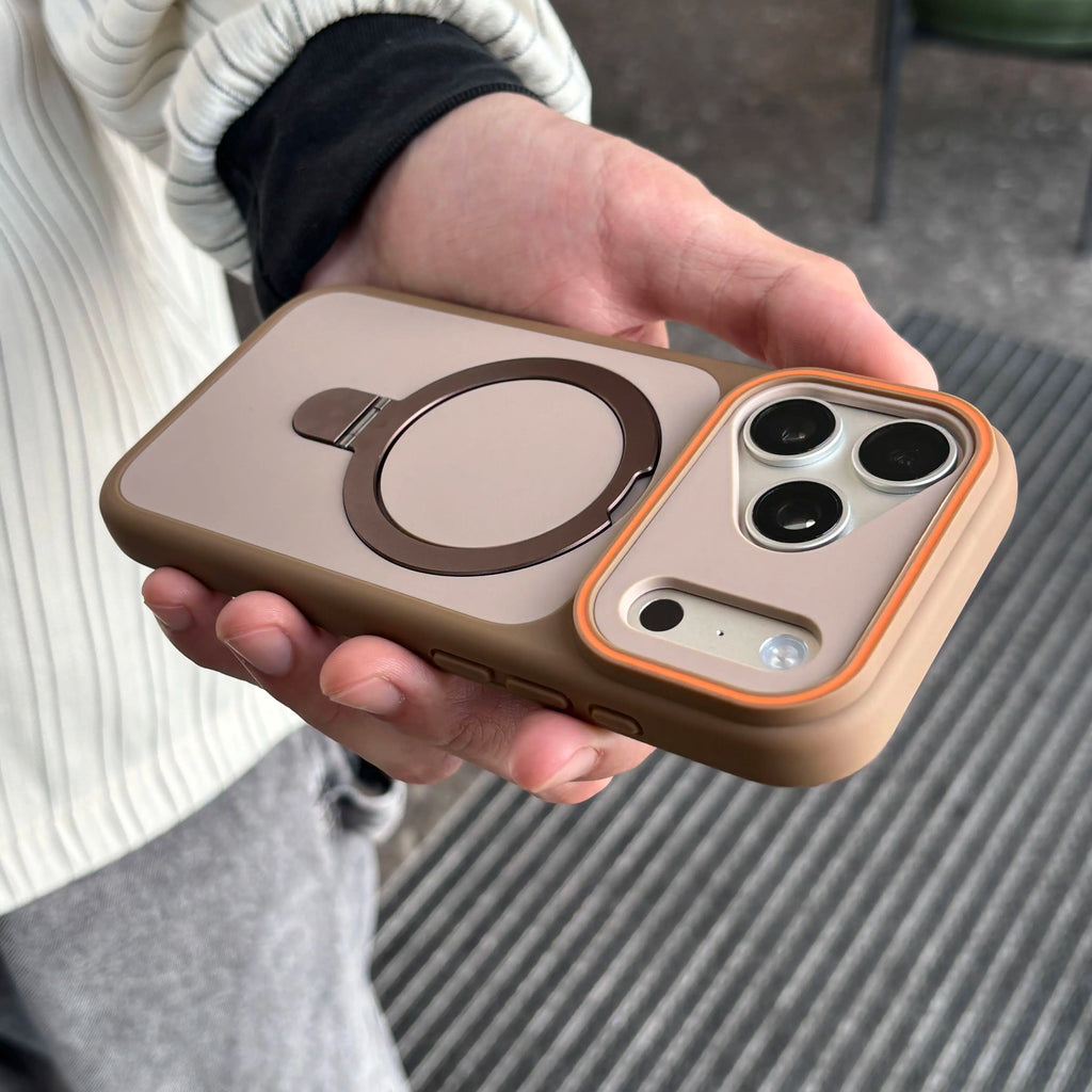 Hand holding a phone case with a ring holder feature