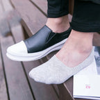 Mens invisible boat cotton socks shown on feet with casual slip on shoes showcasing the low cut profile