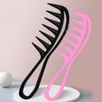 Black and pink hair combs on a light pink background