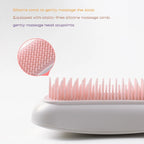 Silicone comb with massage head and static-free feature on a white background