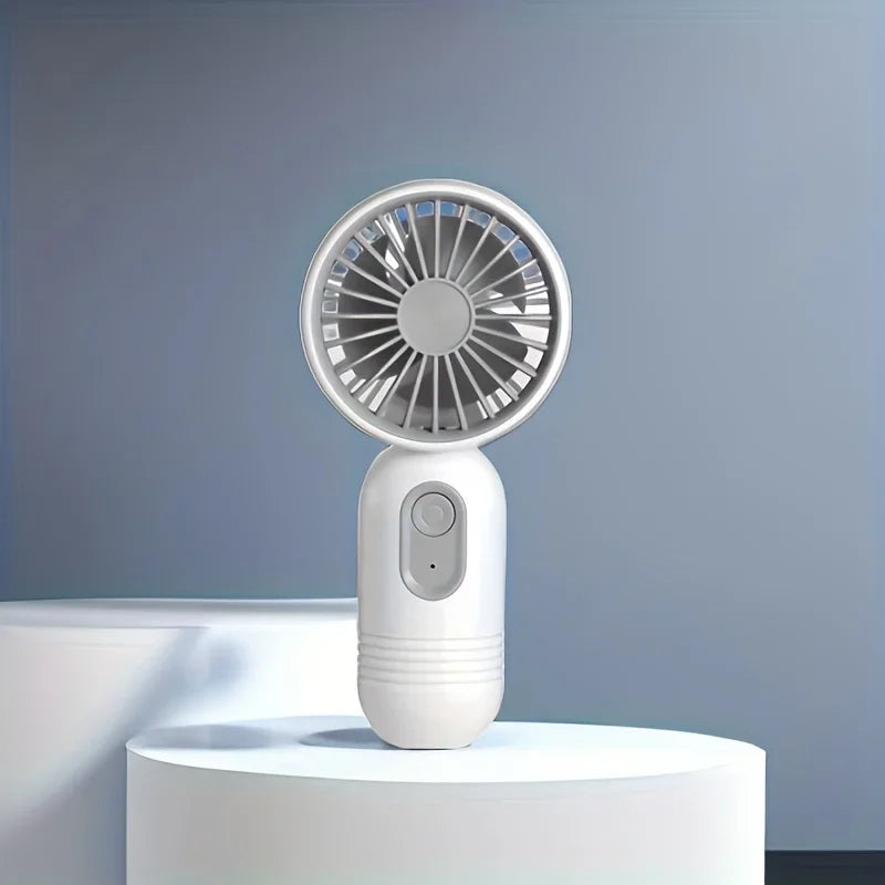 USB rechargeable mini handheld fan by PennyHaul with 3-speed settings, compact portable fan for personal cooling.