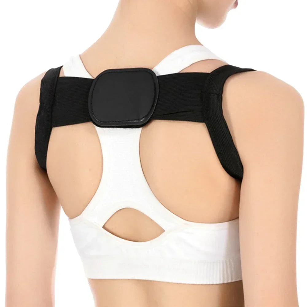 adjustable back posture corrector in black worn over upper back to prevent slouching and back pain
