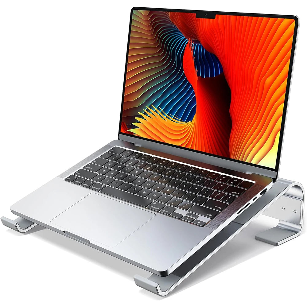 Aluminum laptop cooling stand riser with MacBook mounted to improve viewing angle and desk ergonomics.