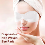 model wearing disposable eye mask paper patch for under eye nourishment and facial skincare treatment