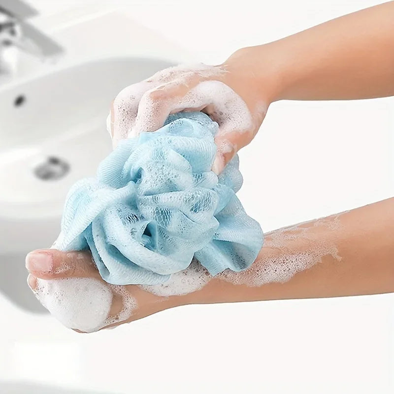 exfoliating bath towel set mesh loofah ball held in hand creating rich foam for gentle body cleansing