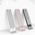 Foldable laptop stand available in multiple colors for desk setup