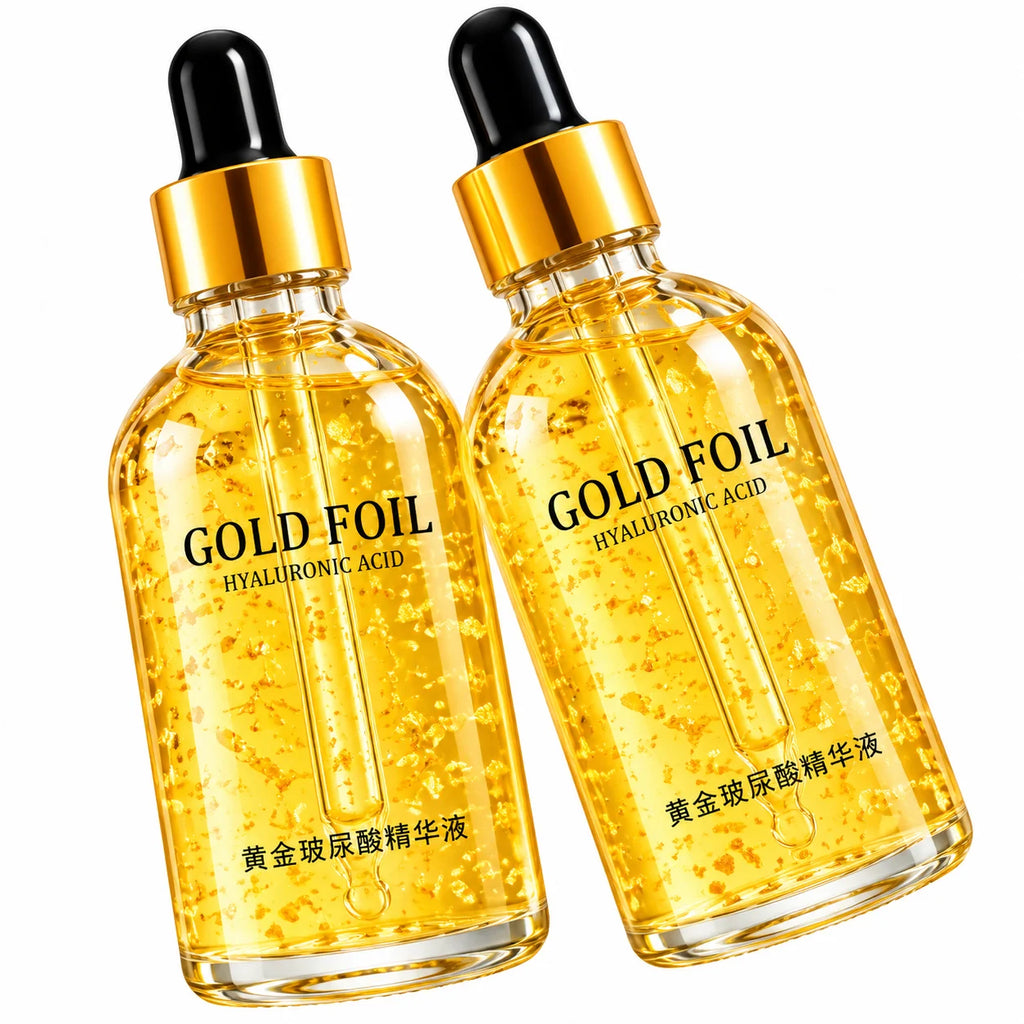 Two clear glass dropper bottles filled with golden hyaluronic acid serum, labeled 'GOLD FOIL' and 'HYALURONIC ACID' with Chinese text near the bottom, shown on a white background.