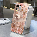 Phone case with floral and butterfly design on a table