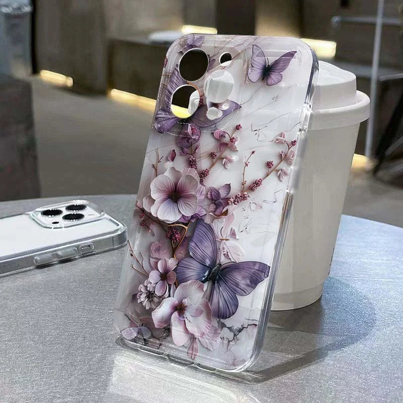 Phone case with floral and butterfly design on a table
