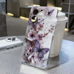 Phone case with floral and butterfly design on a table