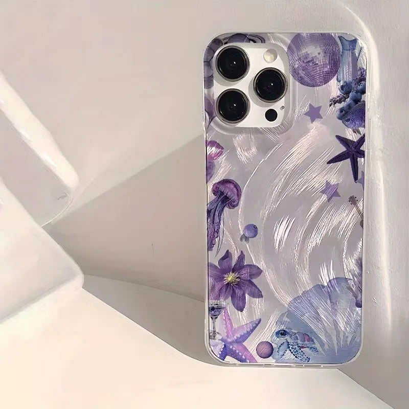 A clear phone case with a purple underwater theme, featuring illustrations of jellyfish, starfish, seashells, and sea plants, shown on a white smartphone.