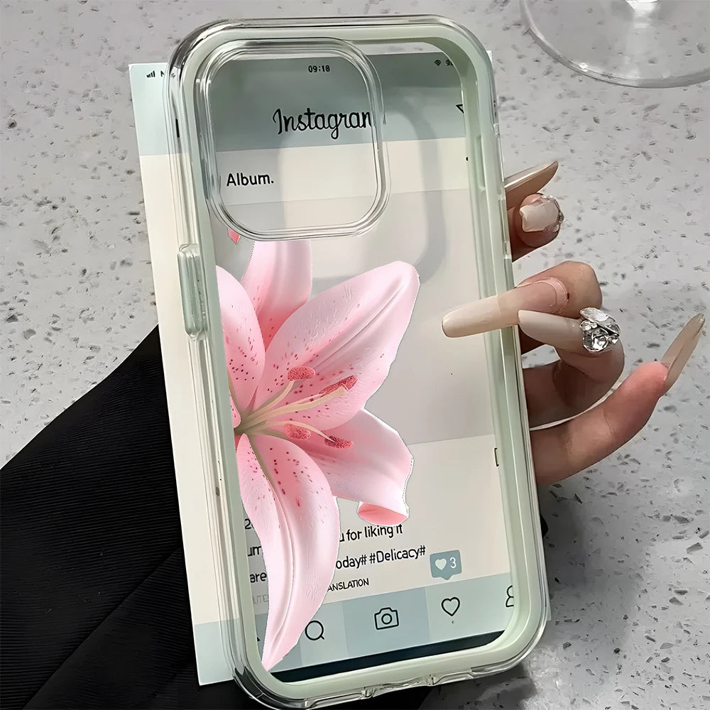 Phone case with a pink flower design held by a hand on a light surface