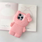 Pink cat-shaped phone case on a magazine