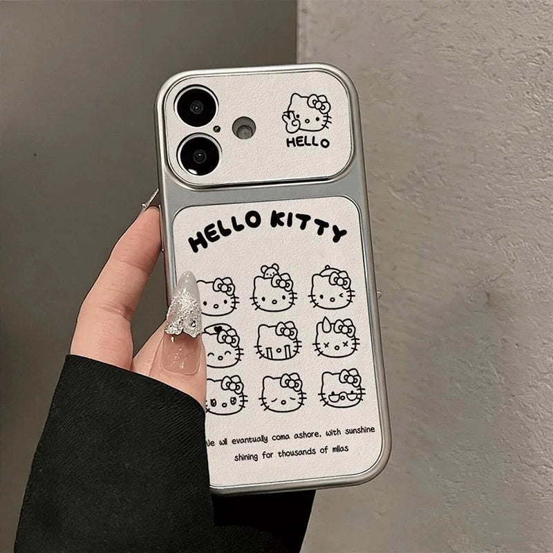 A hand wearing a black sleeve holds a clear phone case decorated with black Hello Kitty illustrations and text on a light gray background.