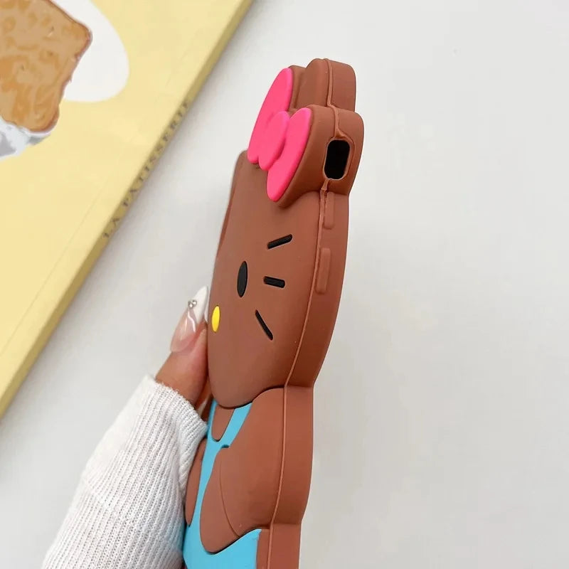 Phone case shaped like a cartoon character with pink ears held by a person wearing a white sweater.