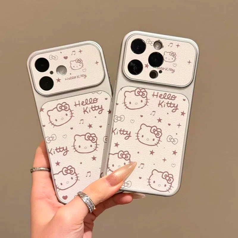 Two Hello Kitty phone cases with a camera cutout, held in a hand. The cases are off-white with pink and brown Hello Kitty illustrations, bows, stars, and the text 'Hello Kitty'.