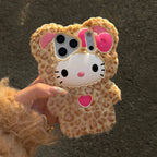 Phone case with a Hello Kitty design held by a person against a dark background