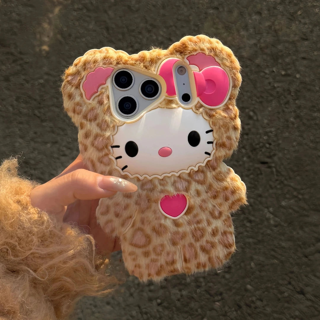 Phone case with a Hello Kitty design held by a person against a dark background