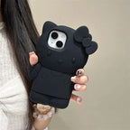 Black cat-shaped phone case held by a person with a neutral background