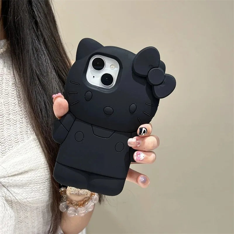 Black cat-shaped phone case held by a person with a neutral background