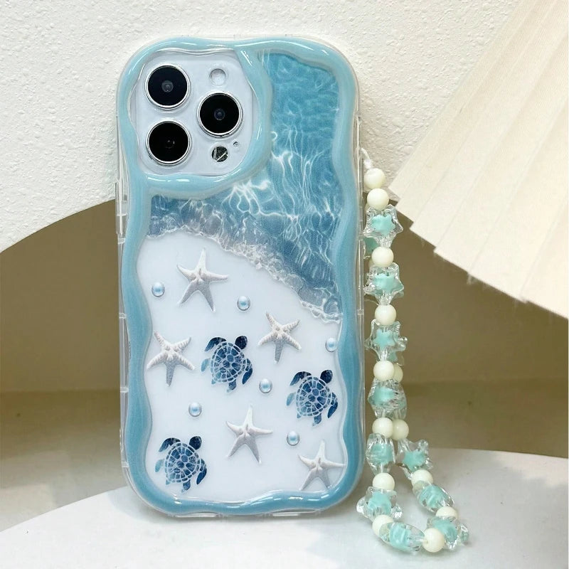 Light blue ocean turtle iPhone case highlighted with wavy edge protection and a clear bead string lanyard.