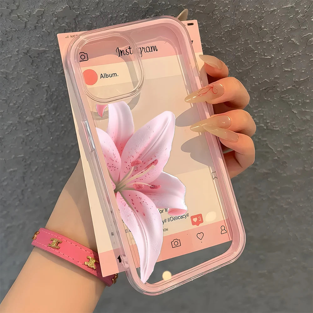 Phone case with pink floral design held by a hand against a gray background