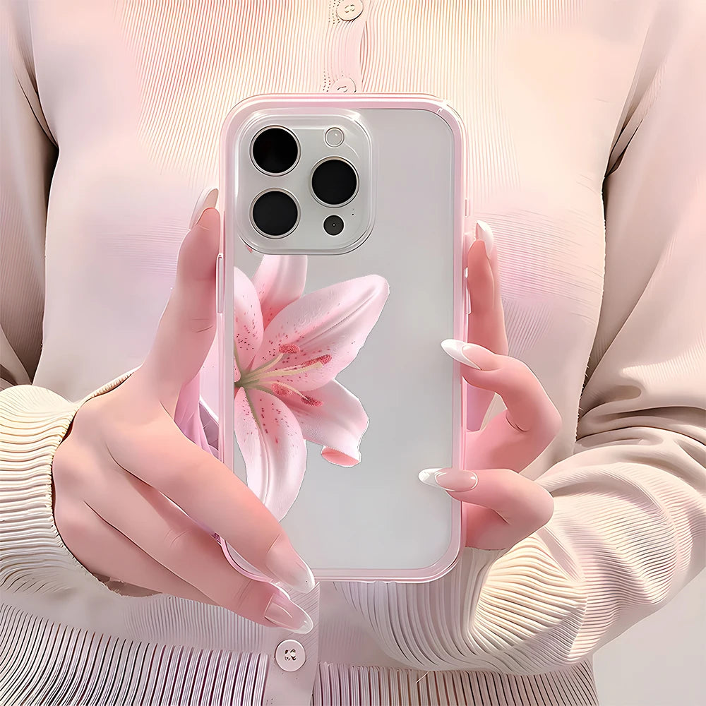 Phone case with a pink flower design held by hands against a light background
