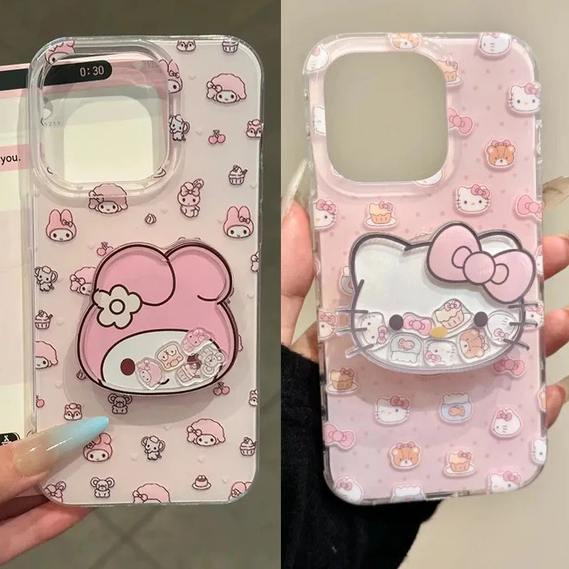 Two pink cartoon phone cases shown side by side, each held in a hand. The left case features a large pink My Melody character graphic with a flower and small repeated pastel motifs.